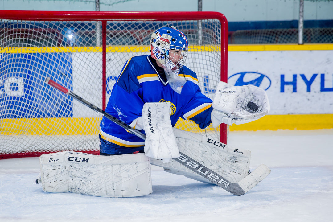 U11 goalie making a save on a coach shot at Shield Goaltending
